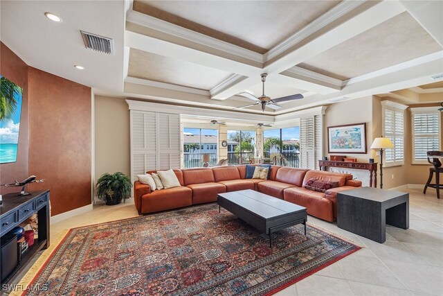 living room with coffered ceiling, ceiling fan, light tile patterned floors, and ornamental molding