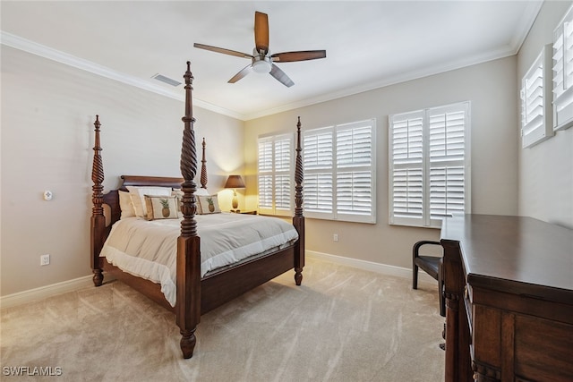 carpeted bedroom with ceiling fan and crown molding