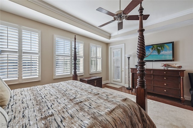 bedroom with ceiling fan, crown molding, and dark hardwood / wood-style flooring