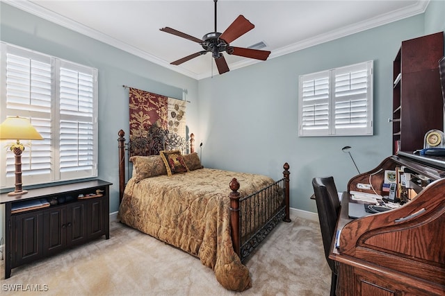 bedroom with light carpet, ceiling fan, and crown molding