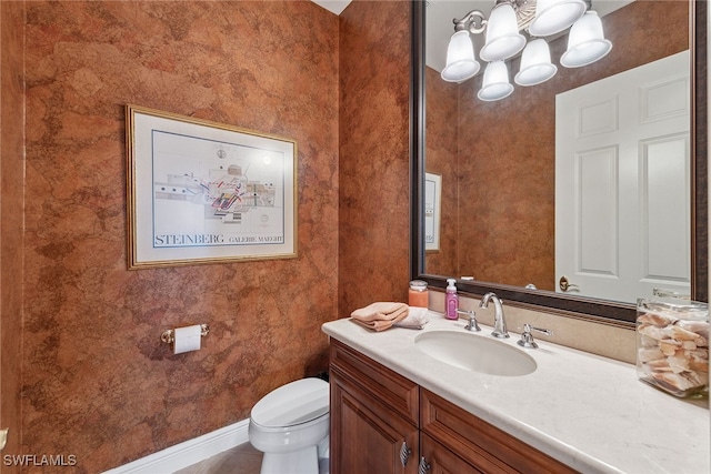 bathroom featuring toilet, vanity, and tile patterned floors