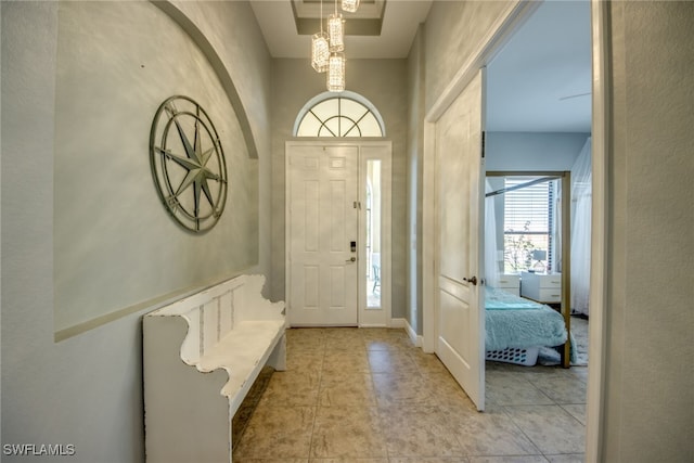 foyer featuring light tile patterned flooring