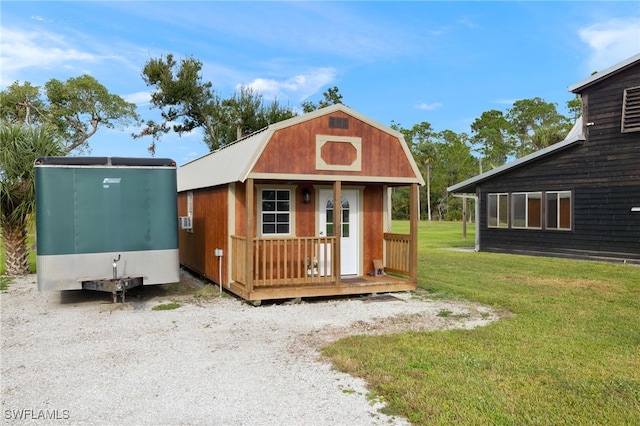 view of outbuilding with a yard