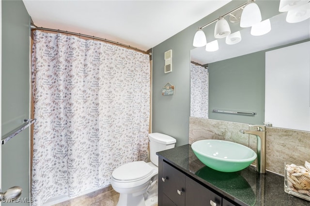 full bathroom featuring visible vents, curtained shower, toilet, and vanity
