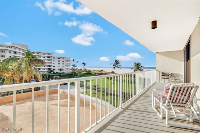 balcony featuring a water view