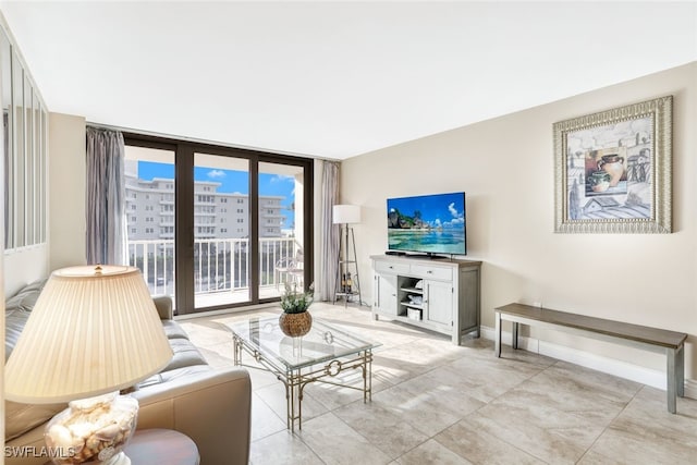 living room featuring floor to ceiling windows