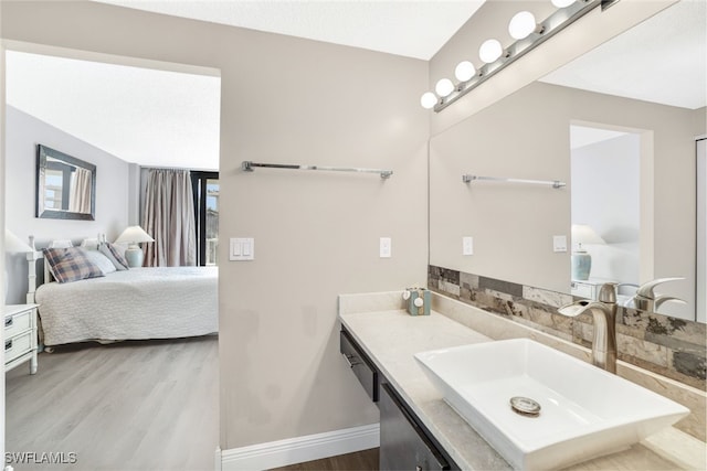 bathroom with vanity and wood-type flooring