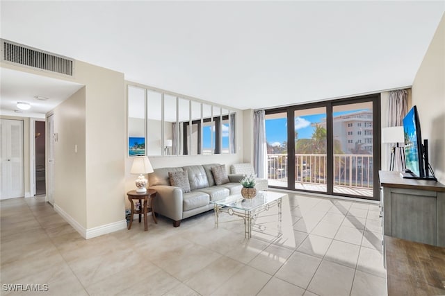 tiled living room with expansive windows