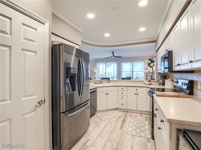 kitchen featuring white cabinetry, sink, ceiling fan, crown molding, and black appliances