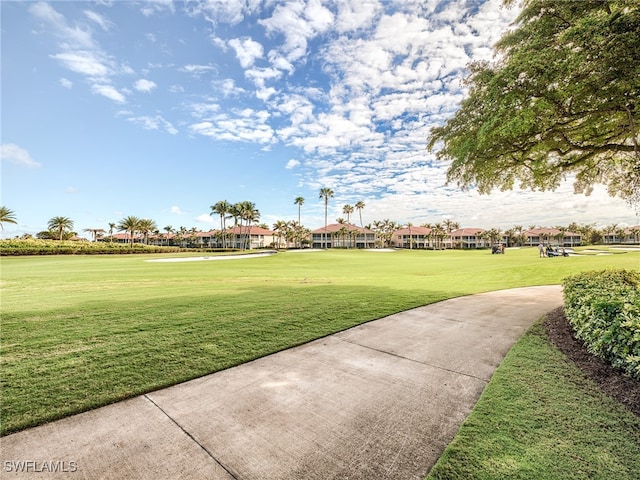 view of property's community with a yard