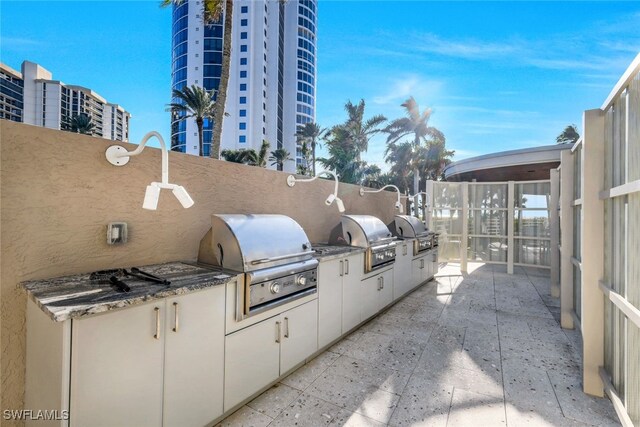 view of patio with exterior kitchen and grilling area