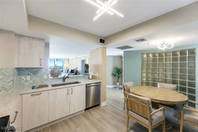 kitchen with decorative backsplash, sink, dishwasher, range, and light hardwood / wood-style floors