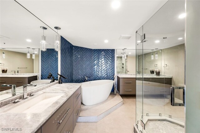 bathroom featuring vanity, ceiling fan, tile walls, and plus walk in shower