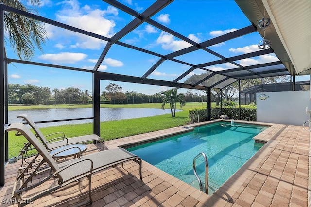 view of pool with a water view, a patio, a lanai, and a yard