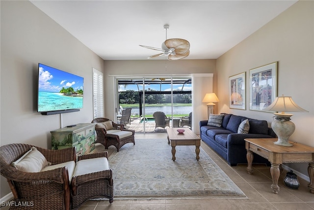 living room featuring ceiling fan and light tile patterned flooring