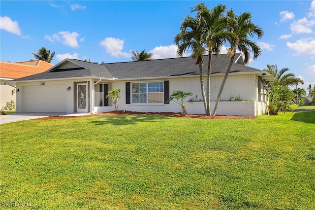 ranch-style home with a front yard and a garage