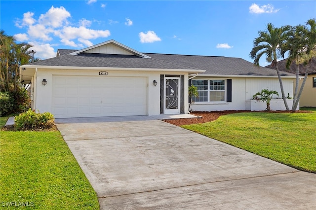 ranch-style home featuring a garage and a front lawn