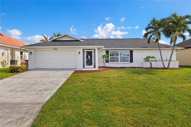 single story home with a garage, a front lawn, and central AC unit