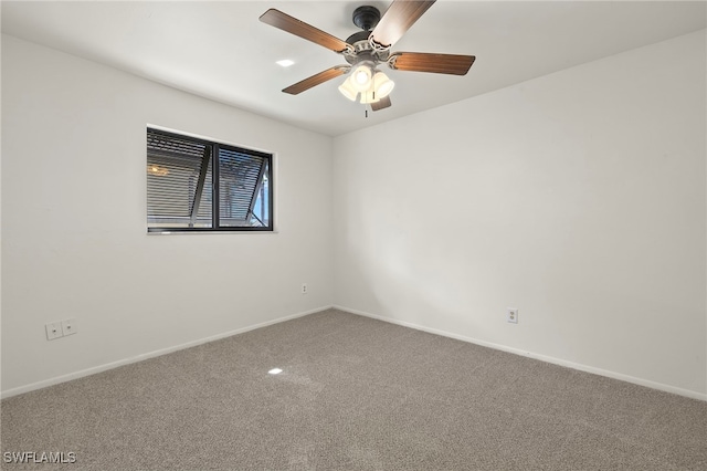 empty room with carpet flooring and ceiling fan