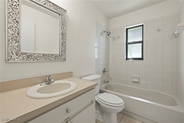 full bathroom with toilet, tiled shower / bath, vanity, and tile patterned flooring