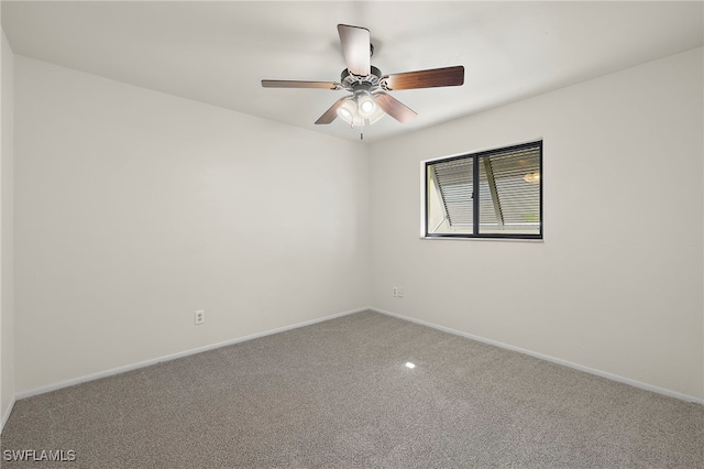 unfurnished room with carpet and ceiling fan