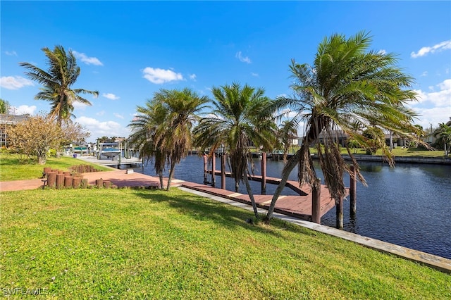 view of dock featuring a yard and a water view