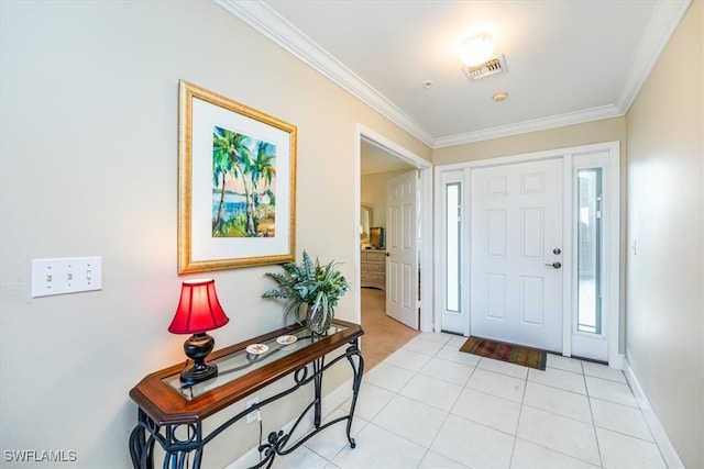 entryway featuring ornamental molding, visible vents, baseboards, and light tile patterned floors