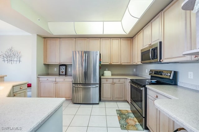 kitchen with light tile patterned flooring, light brown cabinetry, and appliances with stainless steel finishes