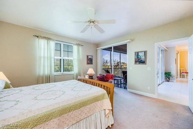 bedroom with light carpet, access to outside, multiple windows, and ceiling fan