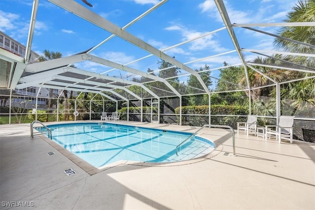 view of pool featuring a lanai and a patio