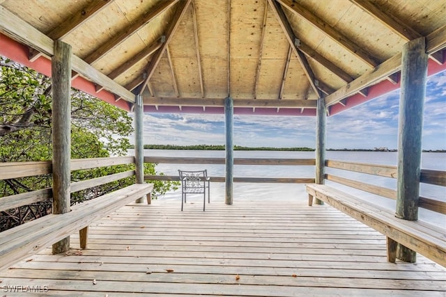 view of dock featuring a gazebo and a water view