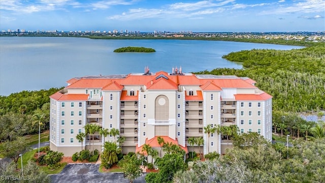 birds eye view of property featuring a water view