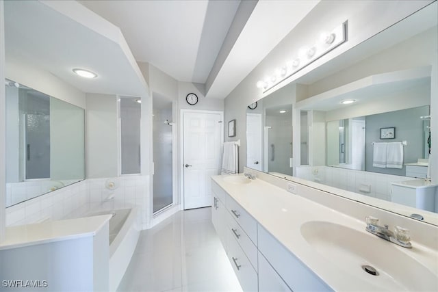 bathroom featuring vanity, separate shower and tub, and tile patterned floors