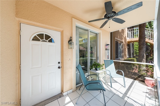 property entrance featuring ceiling fan