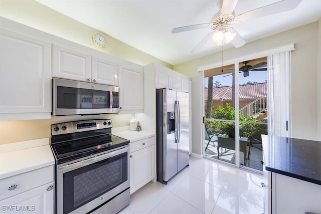 kitchen with white cabinetry, ceiling fan, stainless steel appliances, and light tile patterned flooring