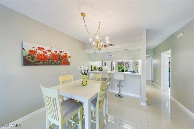 dining space with a notable chandelier and light tile patterned flooring