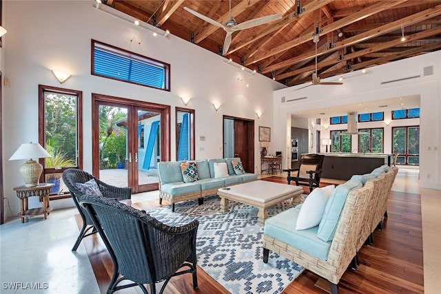 living room with beamed ceiling, high vaulted ceiling, wood-type flooring, wood ceiling, and french doors