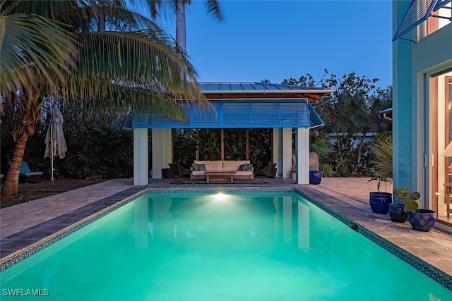 view of swimming pool with an outdoor hangout area and a patio area