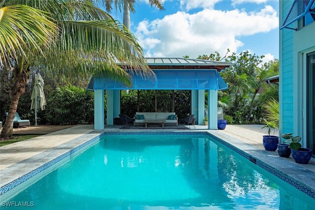 view of swimming pool featuring a patio