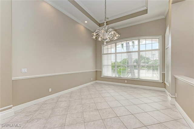 spare room with ornamental molding, an inviting chandelier, and light tile patterned floors