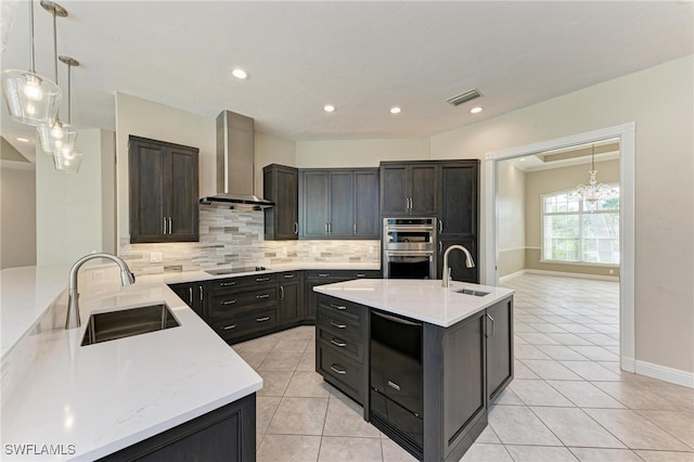 kitchen featuring wall chimney exhaust hood, sink, double oven, and backsplash