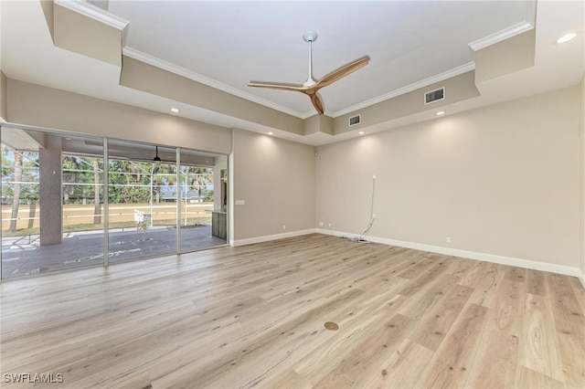 empty room featuring light hardwood / wood-style floors, crown molding, and ceiling fan