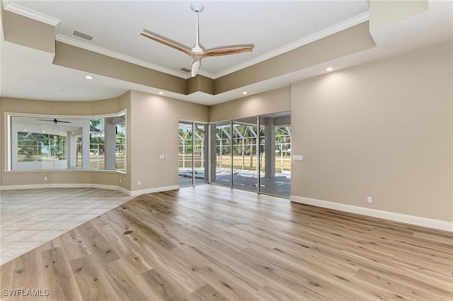 unfurnished room with ornamental molding, light hardwood / wood-style flooring, and plenty of natural light