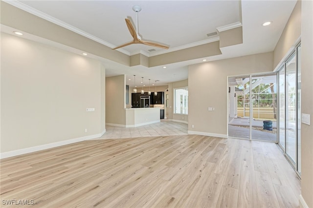 unfurnished living room featuring light hardwood / wood-style floors, crown molding, and ceiling fan