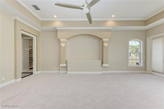 carpeted empty room with crown molding and ceiling fan