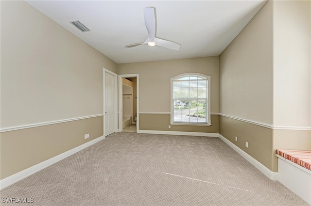 unfurnished room with light carpet and ceiling fan