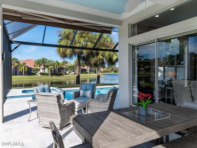 view of patio featuring a water view, ceiling fan, a swimming pool with hot tub, and glass enclosure