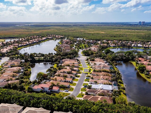 drone / aerial view with a water view