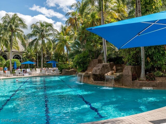 view of pool with pool water feature