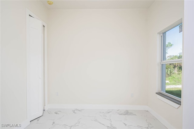 1949 Mariano St, Lehigh Acres, FL 33972 - unfurnished room featuring marble finish floors and baseboards